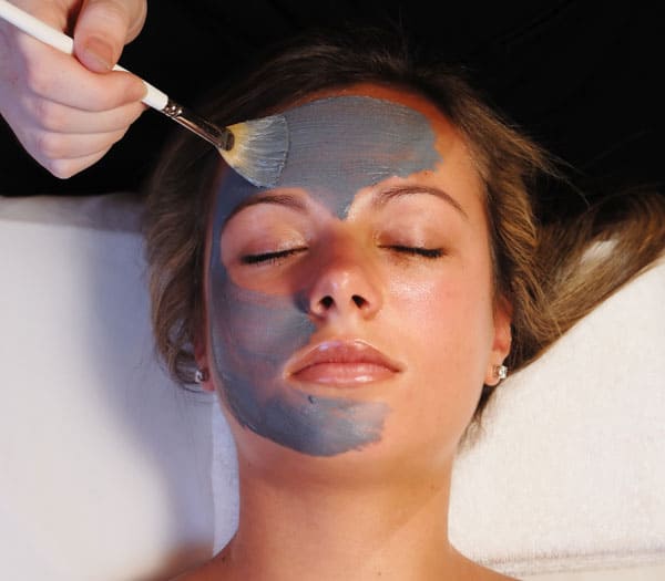 woman getting facial at serenity spa