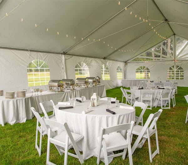 Image of a catering event being hosted in a tent at Peek'n Peak